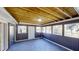 Inviting sunroom with exposed ceiling beams, wood paneled walls, and multiple windows offering pleasant views at 3868 Prentiss Dr, Decatur, GA 30034