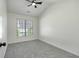 Bright bedroom with a ceiling fan and a window providing plenty of natural light at 4917 Walden Lake Sq, Decatur, GA 30035