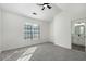 Bright bedroom with a ceiling fan, gray carpet and a window providing plenty of natural light at 4917 Walden Lake Sq, Decatur, GA 30035