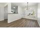 Dining room with a modern light fixture and hardwood floors, perfect for entertaining at 4917 Walden Lake Sq, Decatur, GA 30035