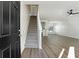 Inviting entryway featuring a staircase, wood flooring, and an open view to the living area at 4917 Walden Lake Sq, Decatur, GA 30035