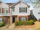 Charming two-story townhouse with brick facade, gray siding, and well-manicured landscaping at 4917 Walden Lake Sq, Decatur, GA 30035