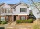 Charming two-story townhome with gray siding, brick accents, and well-maintained landscaping at 4917 Walden Lake Sq, Decatur, GA 30035