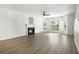 Large living room featuring hardwood floors, fireplace, modern ceiling fan, and plenty of space at 4917 Walden Lake Sq, Decatur, GA 30035