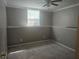 Neutral bedroom featuring a ceiling fan and natural light from the window at 68 Georgias Ln, Dallas, GA 30157
