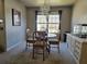 A formal dining room features a chandelier, a table, and large windows at 68 Georgias Ln, Dallas, GA 30157