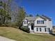 Charming two-story home with vinyl siding and a well-manicured lawn on a sunny day at 68 Georgias Ln, Dallas, GA 30157