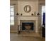 Close-up of the stone fireplace with decorative mantel in the living room at 68 Georgias Ln, Dallas, GA 30157