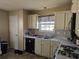 A cozy kitchen features a window above the sink and lots of counter space at 68 Georgias Ln, Dallas, GA 30157