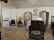 Spacious living room with a decorative archway and neutral carpet throughout at 68 Georgias Ln, Dallas, GA 30157