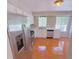Well-lit kitchen with stainless steel appliances, white cabinets, and a view of the outdoors at 566 Aberdeen Dr, Stone Mountain, GA 30083