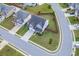 Aerial shot of a well-manicured home with a green lawn, driveway, and surrounding neighborhood at 1788 Hanover West Ct, Lawrenceville, GA 30043