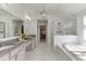 Spa-like bathroom with double vanity, granite countertops, soaking tub and glass enclosed shower at 1788 Hanover West Ct, Lawrenceville, GA 30043