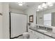 Bathroom featuring granite countertop, white cabinets, and shower with black and white curtain at 1788 Hanover West Ct, Lawrenceville, GA 30043