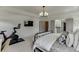 Bright main bedroom with adjacent exercise area, tray ceiling and ensuite bathroom at 1788 Hanover West Ct, Lawrenceville, GA 30043