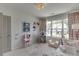 Bright bedroom with large window, play area, and whimsical décor, perfect for children at 1788 Hanover West Ct, Lawrenceville, GA 30043