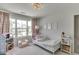 Charming bedroom with dollhouse, toys, a twin bed, and lots of natural light at 1788 Hanover West Ct, Lawrenceville, GA 30043