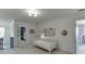 Bright room featuring white walls and decor, art, and access to additional rooms at 1788 Hanover West Ct, Lawrenceville, GA 30043
