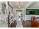 Elegant foyer with dark hardwood floors, stylish furnishings, and decorative lighting fixtures at 1788 Hanover West Ct, Lawrenceville, GA 30043