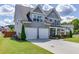 Stylish two-story home with a well-maintained lawn, tidy landscaping, and attached two-car garage at 1788 Hanover West Ct, Lawrenceville, GA 30043