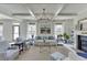 Cozy living room with fireplace, ample seating, and natural light, creating a relaxing atmosphere at 1788 Hanover West Ct, Lawrenceville, GA 30043