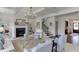 Bright living room with fireplace, coffered ceiling, and staircase access exudes elegance and charm at 1788 Hanover West Ct, Lawrenceville, GA 30043