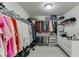 Spacious walk-in closet with custom shelving and ample hanging space for storage at 1788 Hanover West Ct, Lawrenceville, GA 30043