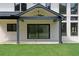 Covered back porch with ceiling fan, and sliding door access at 3240 Miller Bottom Rd, Conyers, GA 30012