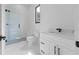 Bright bathroom with glass shower, white marble tile, and modern fixtures at 3240 Miller Bottom Rd, Conyers, GA 30012