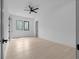 A bedroom features wood floors, recessed lighting, and windows overlooking trees at 3240 Miller Bottom Rd, Conyers, GA 30012