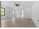 Spacious bedroom with modern ceiling fan, and two large windows offering ample natural light at 3240 Miller Bottom Rd, Conyers, GA 30012