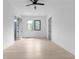 Spacious bedroom with wood floors, ceiling fan, recessed lights and black framed windows at 3240 Miller Bottom Rd, Conyers, GA 30012