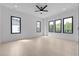Large bedroom with wood flooring, recessed lighting, and many windows to the outside at 3240 Miller Bottom Rd, Conyers, GA 30012