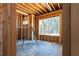 Framing and window installation during new home construction phase at 3240 Miller Bottom Rd, Conyers, GA 30012