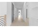 Hallway with minimalist wood railing and a view of a bedroom at the end of the hall at 3240 Miller Bottom Rd, Conyers, GA 30012