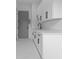 Modern kitchen featuring white cabinets, quartz countertops, and stainless steel faucet at 3240 Miller Bottom Rd, Conyers, GA 30012