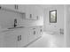 Bright laundry room featuring quartz countertops, cabinets, and marble tile flooring at 3240 Miller Bottom Rd, Conyers, GA 30012