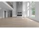 Light filled living room boasting soaring ceilings, fireplace with shelving, and expansive windows, creating an inviting space at 3240 Miller Bottom Rd, Conyers, GA 30012