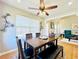 Bright dining room with modern light fixture, open to living space, and hardwood floors at 4962 Newpark Nw Ln, Acworth, GA 30101
