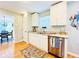 Well-lit kitchen with stainless steel appliances, granite countertops, and hardwood floors at 4962 Newpark Nw Ln, Acworth, GA 30101