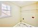 The laundry room offers tile floors, natural light, shelving, and utility connections at 4962 Newpark Nw Ln, Acworth, GA 30101