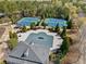 Aerial view of community pool, tennis courts, and surrounding landscape at 548 Lawton Bridge Sw Rd, Smyrna, GA 30082