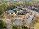 Overhead view of a community with tennis courts, a playground, pool and lush greenery in a suburban setting at 548 Lawton Bridge Sw Rd, Smyrna, GA 30082