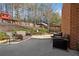 Wonderful outdoor patio area with trees and a play set for a backyard retreat at 548 Lawton Bridge Sw Rd, Smyrna, GA 30082