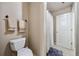 Cozy bathroom featuring tile floors, a toilet, and a shower with a patterned curtain at 548 Lawton Bridge Sw Rd, Smyrna, GA 30082