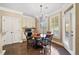 Bright breakfast nook with built-in cabinets, hardwood floors, and a bay window at 548 Lawton Bridge Sw Rd, Smyrna, GA 30082