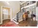 Elegant foyer with hardwood floors, staircase, ornate banister, and stylish console table, creating a grand entrance at 548 Lawton Bridge Sw Rd, Smyrna, GA 30082