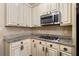 Kitchen with granite countertops, stainless steel appliances, and ample cabinet space at 548 Lawton Bridge Sw Rd, Smyrna, GA 30082