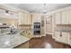 Well-lit kitchen featuring granite countertops, stainless steel appliances, and hardwood floors at 548 Lawton Bridge Sw Rd, Smyrna, GA 30082