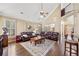 Spacious living room with hardwood floors, large windows, and elegant furnishings at 548 Lawton Bridge Sw Rd, Smyrna, GA 30082